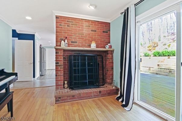 Fireplace, Interior, Piano, Recessed Lighting, Stone Walls, Wood Texture Flooring