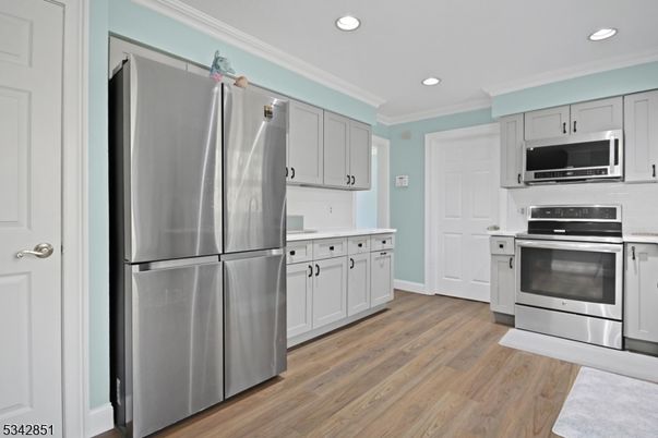 Interior, Kitchen, Recessed Lighting, Stainless Steel Appliances, Wood Texture Flooring
