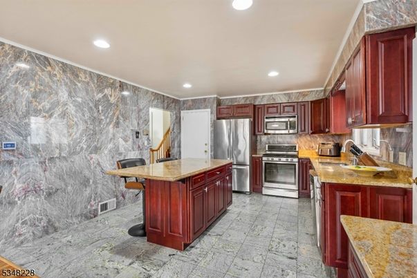 Interior, Kitchen, Marble Walls, Recessed Lighting, Stainless Steel Appliances