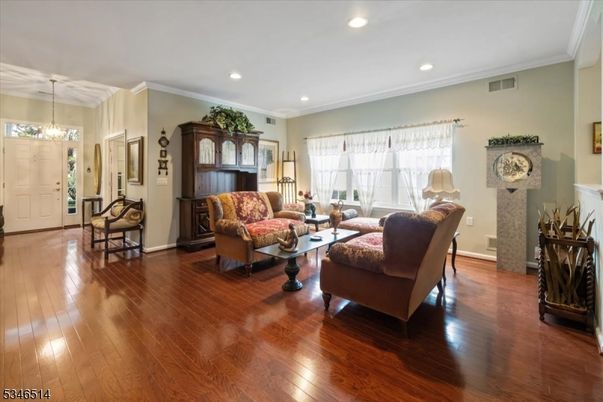 Chandelier, Fireplace, Interior, Living room, Recessed Lighting, Wood Texture Flooring
