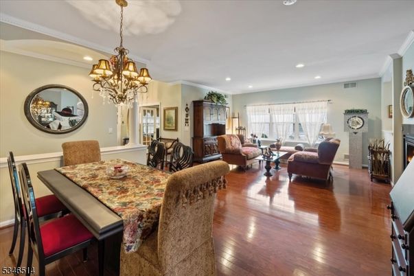 Chandelier, Dining room, Fireplace, Interior, Living room, Recessed Lighting, Wood Texture Flooring