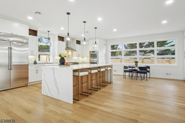 Dining room, Interior, Kitchen, Pendant Lights, Recessed Lighting, Stainless Steel Appliances, Wood Texture Flooring