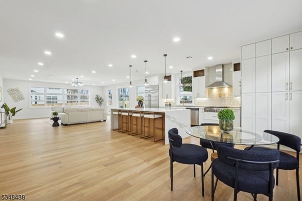 Dining room, Interior, Kitchen, Living room, Pendant Lights, Recessed Lighting, Stainless Steel Appliances, Wood Texture Flooring