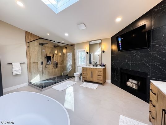 Bathroom, Dual Sink Vanities, Fireplace, Free Standing Baths, Glass Shower, Interior, Marble Walls, Recessed Lighting
