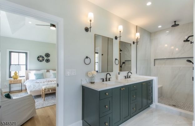 Bathroom, Bedroom, Dual Sink Vanities, Glass Shower, Interior, Marble, Marble Walls, Recessed Lighting, Wood Texture Flooring
