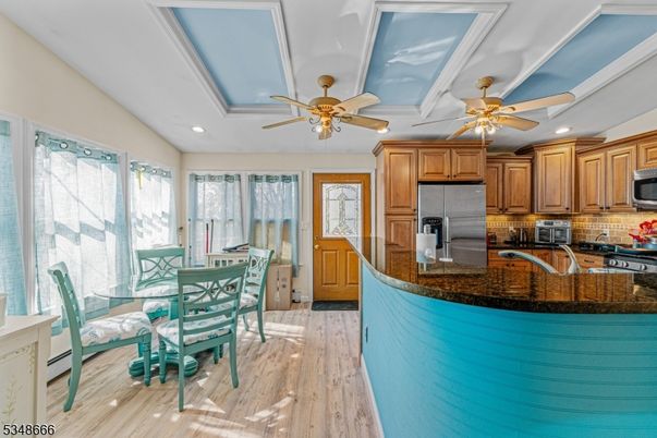 Dining room, Interior, Kitchen, Recessed Lighting, Stainless Steel Appliances, Wood Texture Flooring