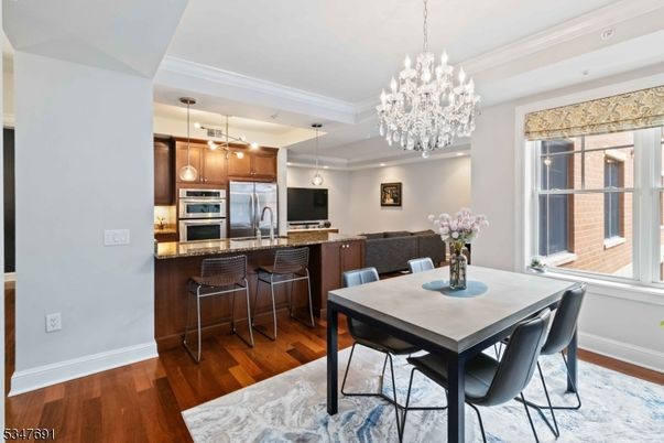 Chandelier, Dining room, Interior, Kitchen, Pendant Lights, Recessed Lighting, Stainless Steel Appliances, Wood Texture Flooring