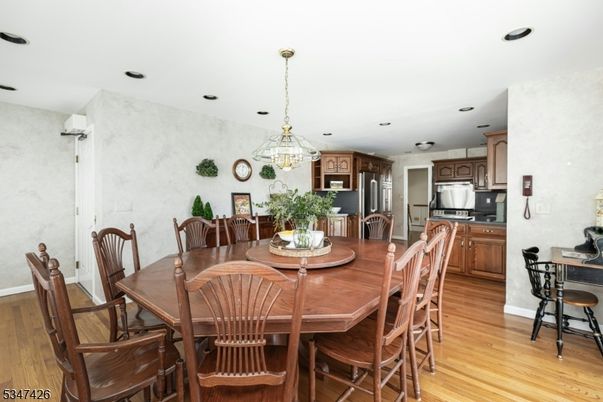 Dining room, Interior, Kitchen, Pendant Lights, Recessed Lighting, Stainless Steel Appliances, Wood Texture Flooring