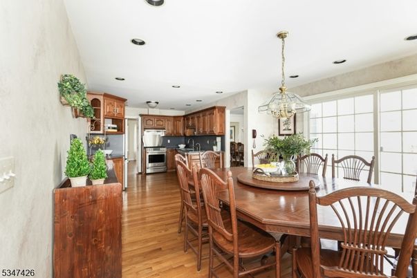 Dining room, Interior, Kitchen, Pendant Lights, Recessed Lighting, Stainless Steel Appliances, Wood Texture Flooring