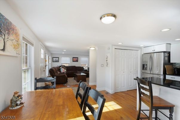 Dining room, Interior, Kitchen, Living room, Recessed Lighting, Stainless Steel Appliances, Wood Texture Flooring