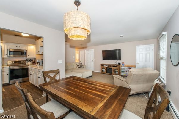 Chandelier, Dining room, Interior, Kitchen, Living room, Recessed Lighting, Stainless Steel Appliances, Wood Texture Flooring