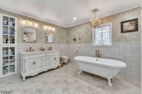 Bathroom, Chandelier, Dual Sink Vanities, Free Standing Baths, Interior, Recessed Lighting