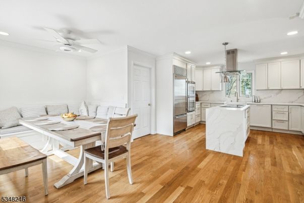 Dining room, Interior, Kitchen, Recessed Lighting, Stainless Steel Appliances, Wood Texture Flooring