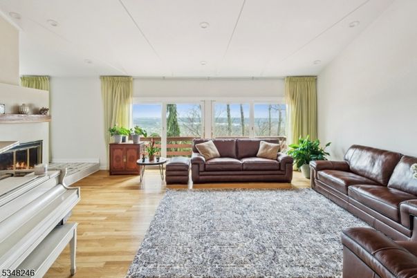 Fireplace, Interior, Living room, Piano, Recessed Lighting, Wood Texture Flooring