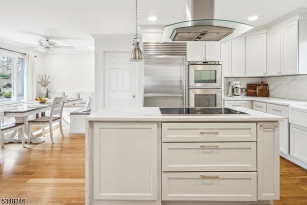 Dining room, Interior, Kitchen, Pendant Lights, Recessed Lighting, Stainless Steel Appliances, Wood Texture Flooring