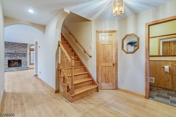 Fireplace, Interior, Recessed Lighting, Stone Walls, Wood Texture Flooring