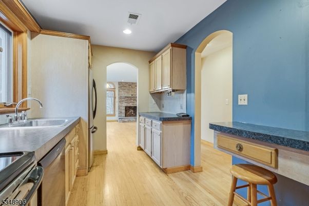 Fireplace, Interior, Kitchen, Recessed Lighting, Stone Walls, Wood Texture Flooring
