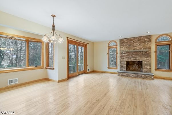 Empty room, Fireplace, Interior, Pendant Lights, Recessed Lighting, Stone Walls, Wood Texture Flooring