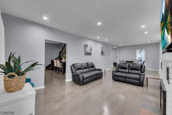 Dining room, Fireplace, Interior, Living room, Recessed Lighting, Wood Texture Flooring