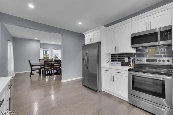 Dining room, Interior, Kitchen, Recessed Lighting, Stainless Steel Appliances, Wood Texture Flooring