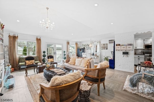 Chandelier, Dining room, Interior, Kitchen, Living room, Recessed Lighting, Stainless Steel Appliances, Wood Texture Flooring