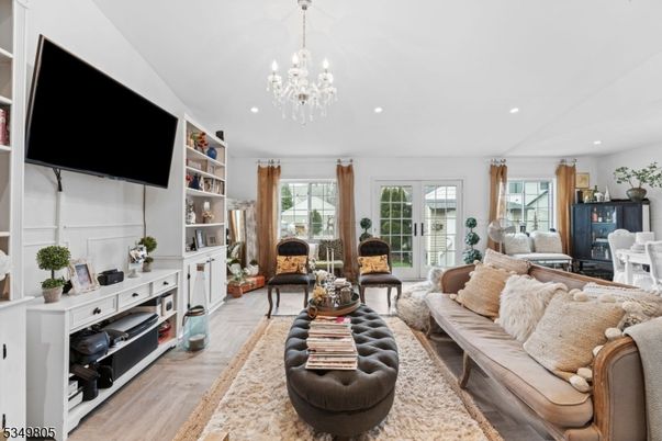 Chandelier, Fireplace, Interior, Living room, Recessed Lighting, Wood Texture Flooring