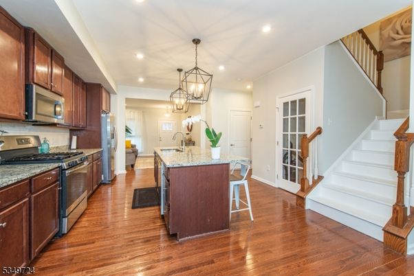 Chandelier, Interior, Kitchen, Pendant Lights, Recessed Lighting, Stainless Steel Appliances, Wood Texture Flooring