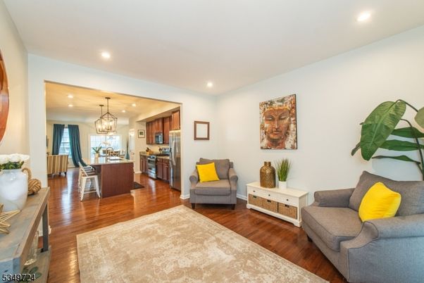 Dining room, Interior, Kitchen, Living room, Pendant Lights, Recessed Lighting, Stainless Steel Appliances, Wood Texture Flooring