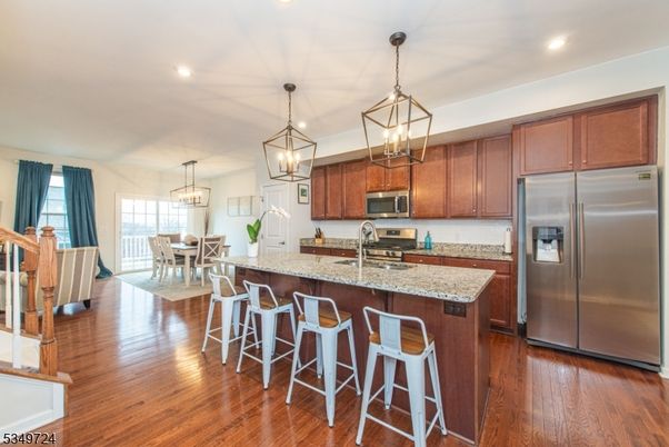 Chandelier, Dining room, Interior, Kitchen, Pendant Lights, Recessed Lighting, Stainless Steel Appliances, Wood Texture Flooring
