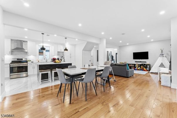 Dining room, Interior, Kitchen, Living room, Pendant Lights, Recessed Lighting, Stainless Steel Appliances, Wood Texture Flooring