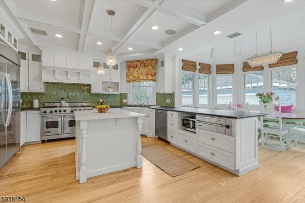Dining room, Interior, Kitchen, Pendant Lights, Recessed Lighting, Stainless Steel Appliances, Wood Texture Flooring