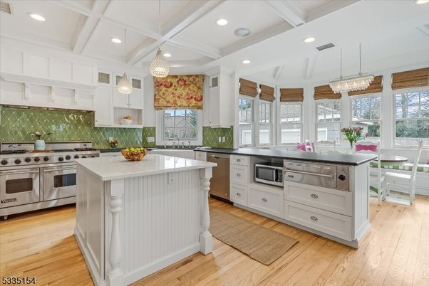 Chandelier, Dining room, Interior, Kitchen, Pendant Lights, Recessed Lighting, Stainless Steel Appliances, Wood Texture Flooring