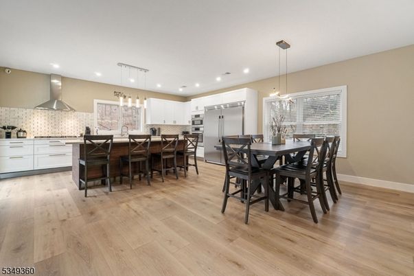 Dining room, Interior, Kitchen, Pendant Lights, Recessed Lighting, Stainless Steel Appliances, Wood Texture Flooring