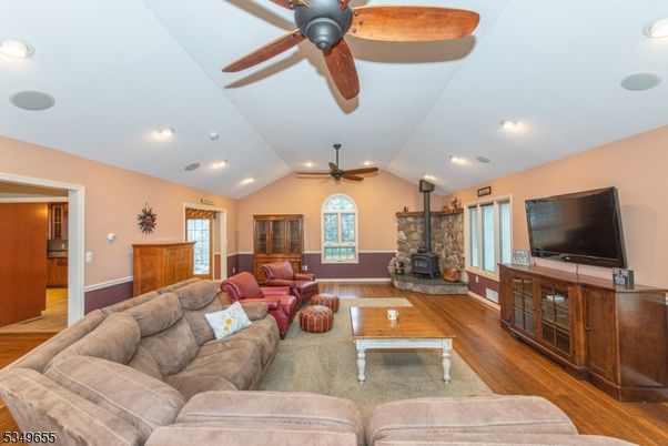 Fireplace, Interior, Living room, Recessed Lighting, Stone Walls, Wood Texture Flooring
