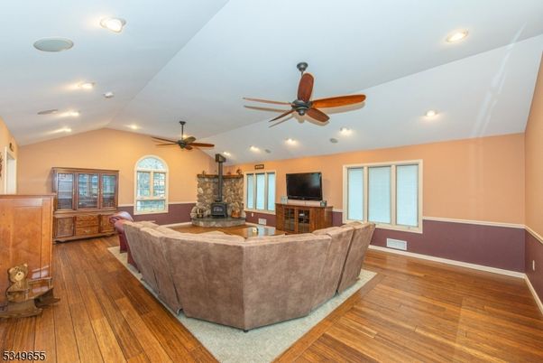 Fireplace, Interior, Living room, Recessed Lighting, Stone Walls, Wood Texture Flooring