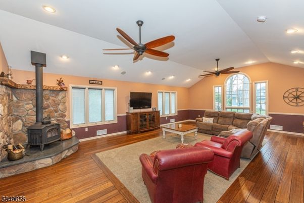 Fireplace, Interior, Living room, Recessed Lighting, Stone Walls, Wood Texture Flooring