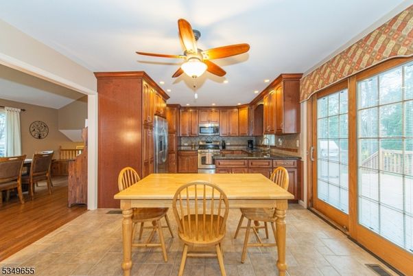 Dining room, Interior, Kitchen, Recessed Lighting, Stainless Steel Appliances, Wood Texture Flooring