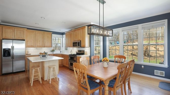 Dining room, Interior, Kitchen, Pendant Lights, Recessed Lighting, Stainless Steel Appliances, Wood Texture Flooring