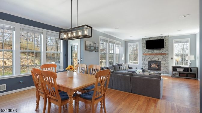 Dining room, Fireplace, Interior, Living room, Pendant Lights, Stone Walls, Wood Texture Flooring