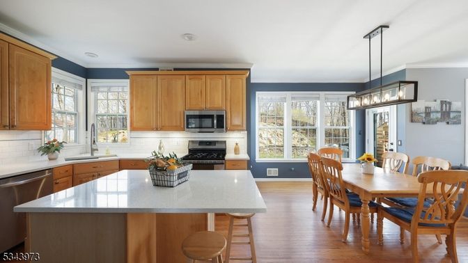 Dining room, Interior, Kitchen, Pendant Lights, Recessed Lighting, Stainless Steel Appliances, Wood Texture Flooring