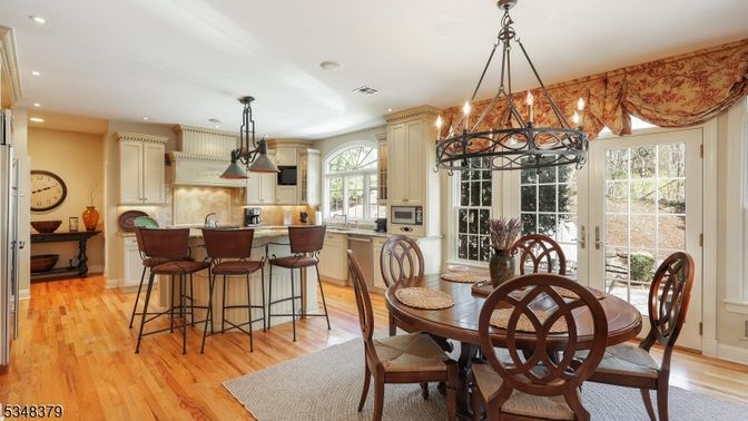Chandelier, Dining room, Interior, Kitchen, Pendant Lights, Recessed Lighting, Stainless Steel Appliances, Wood Texture Flooring