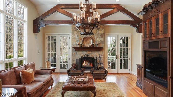 Chandelier, Fireplace, Interior, Living room, Recessed Lighting, Stone Walls, Wooden Beams, Wood Texture Flooring
