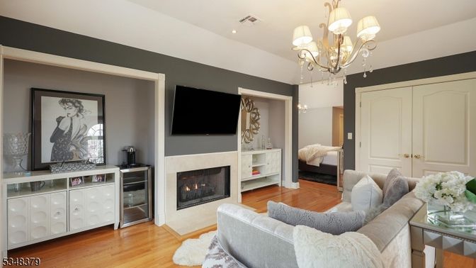 Chandelier, Fireplace, Interior, Living room, Recessed Lighting, Wood Texture Flooring