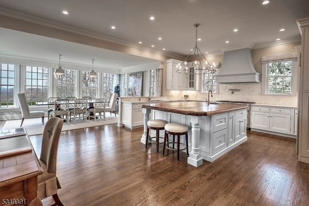Chandelier, Dining room, Interior, Kitchen, Pendant Lights, Recessed Lighting, Stainless Steel Appliances, Wood Texture Flooring