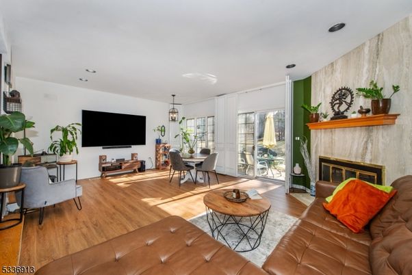 Dining room, Fireplace, Interior, Living room, Pendant Lights, Recessed Lighting, Wood Texture Flooring