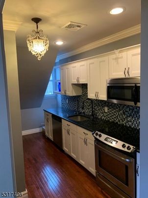 Chandelier, Interior, Kitchen, Recessed Lighting, Stainless Steel Appliances, Wood Texture Flooring