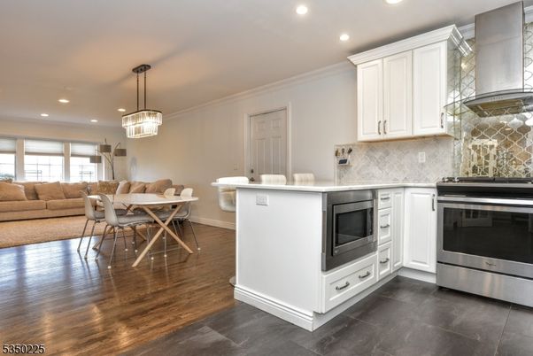 Dining room, Interior, Kitchen, Living room, Pendant Lights, Recessed Lighting, Stainless Steel Appliances, Wood Texture Flooring