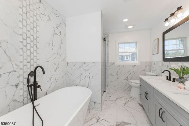 Bathroom, Dual Sink Vanities, Free Standing Baths, Glass Shower, Interior, Marble, Marble Walls, Recessed Lighting