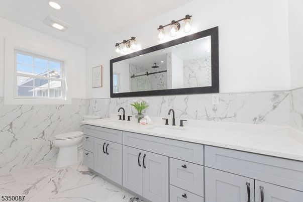 Bathroom, Dual Sink Vanities, Interior, Marble, Marble Walls, Recessed Lighting