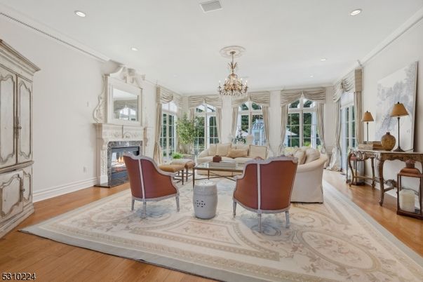 Chandelier, Fireplace, Interior, Living room, Recessed Lighting, Wood Texture Flooring
